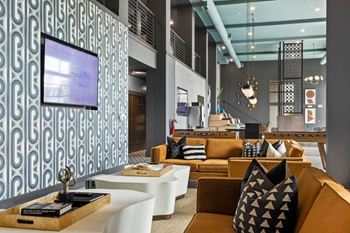 Gaming lounge with billiards, foosball, shuffleboard, and vintage arcade games